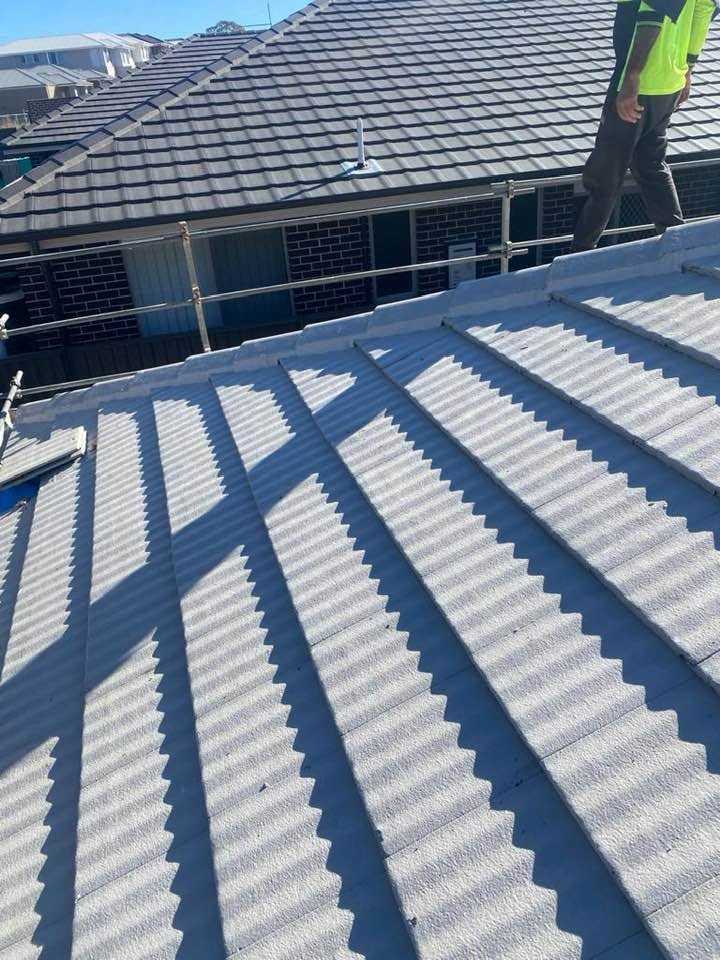 Ridge and hip lines running out across a charcoal tile roof.